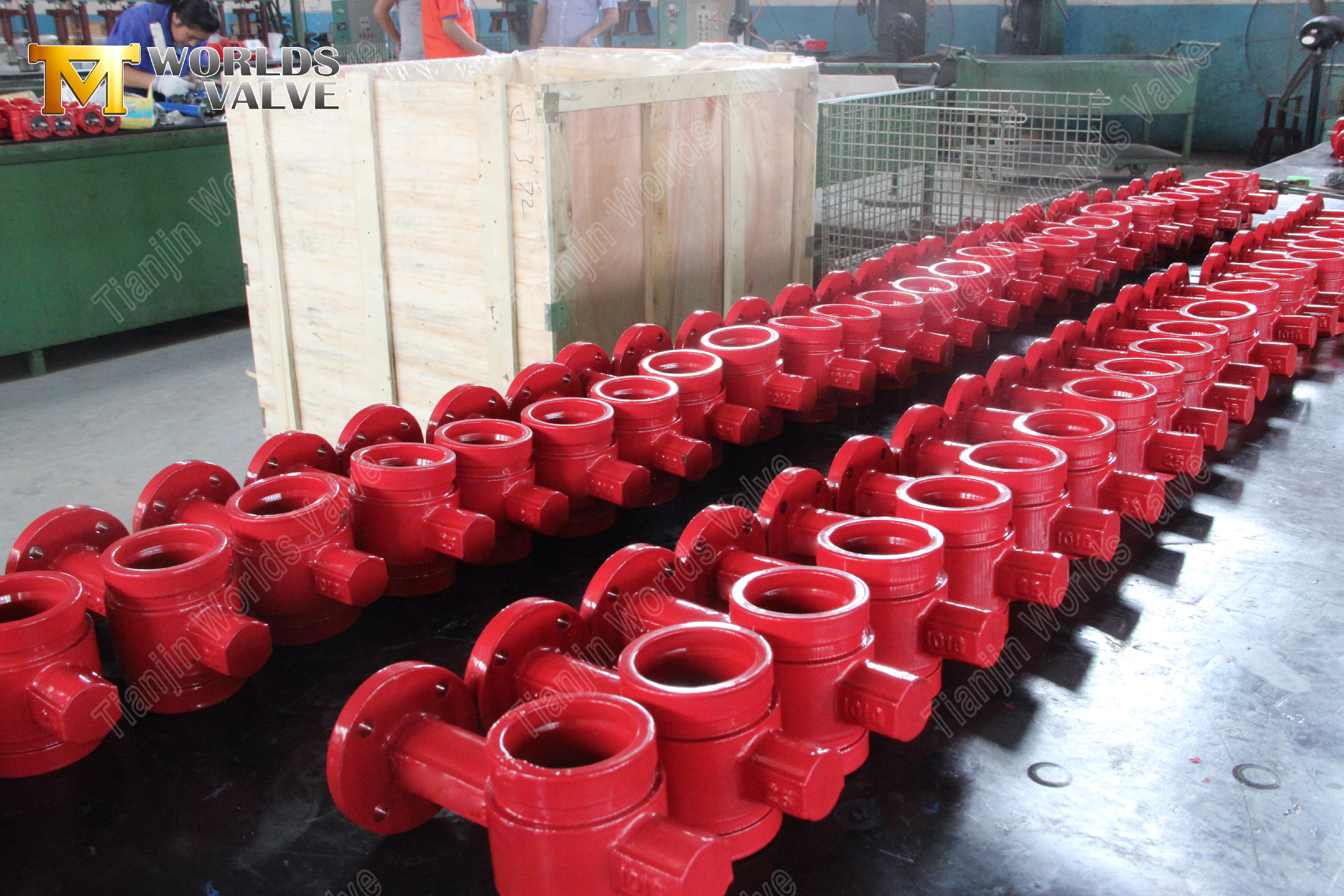 Red grooved butterfly valves in organized warehouse storage.